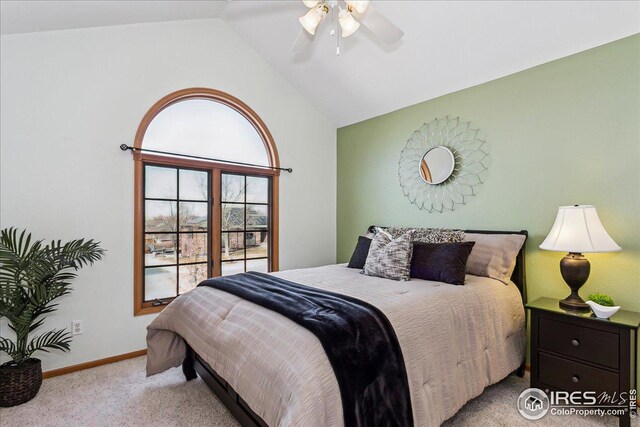 bedroom featuring baseboards, a ceiling fan, carpet flooring, and vaulted ceiling