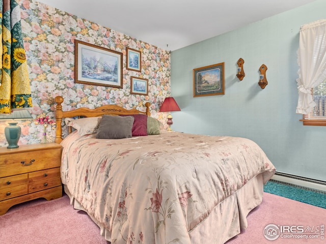 bedroom featuring wallpapered walls, a baseboard heating unit, and carpet