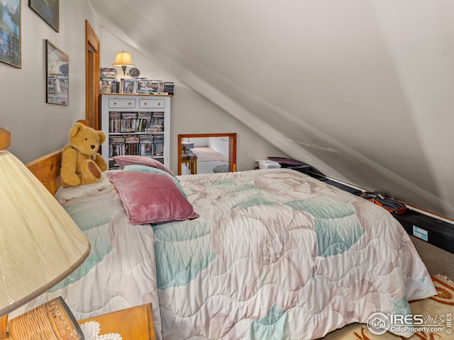 bedroom featuring vaulted ceiling