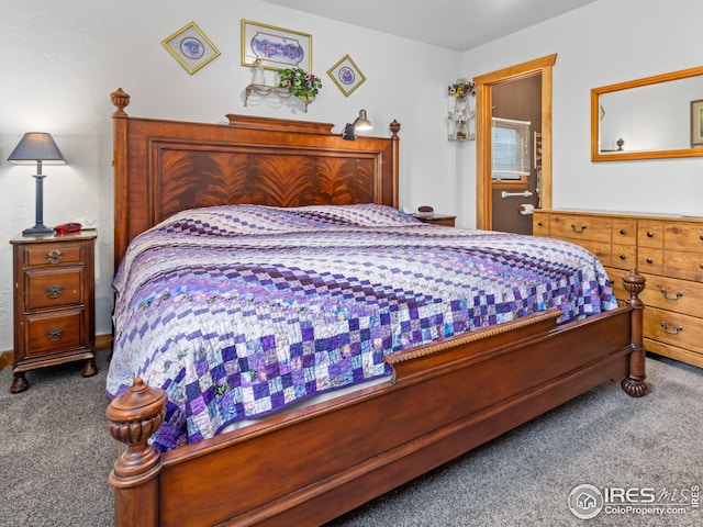 carpeted bedroom with connected bathroom