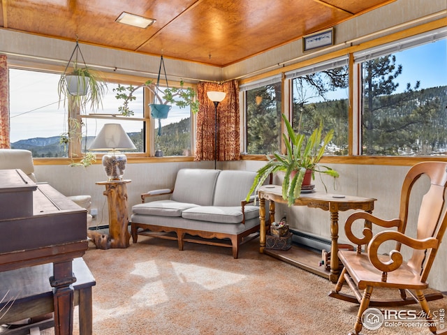 sunroom / solarium with wooden ceiling and baseboard heating