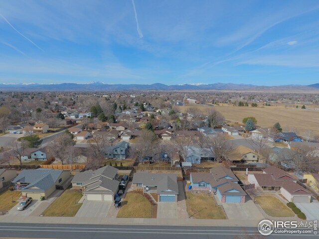 drone / aerial view with a residential view and a mountain view