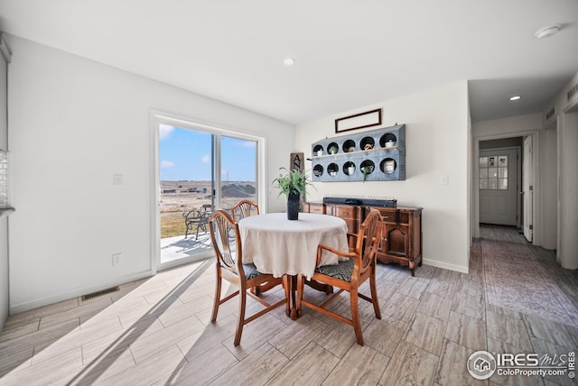 dining area featuring visible vents, recessed lighting, baseboards, and wood finish floors