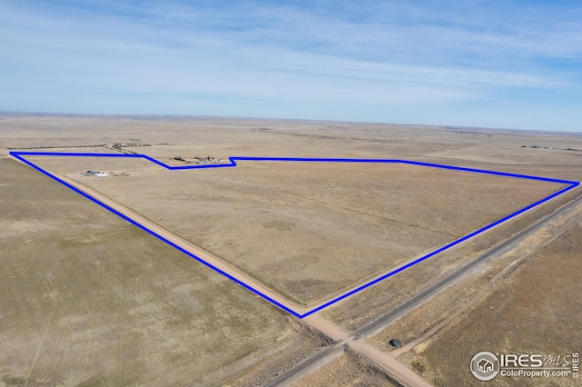 birds eye view of property featuring a rural view