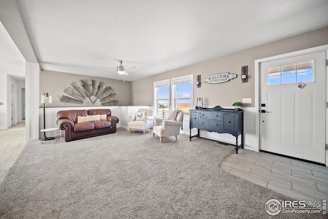 living room featuring wood finished floors and ceiling fan