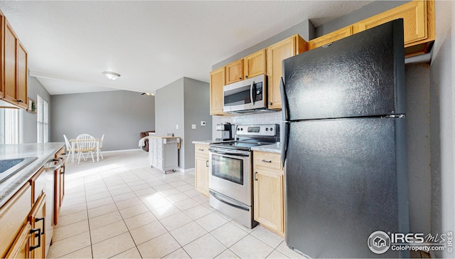 kitchen with light tile patterned floors, baseboards, stainless steel appliances, decorative backsplash, and light countertops