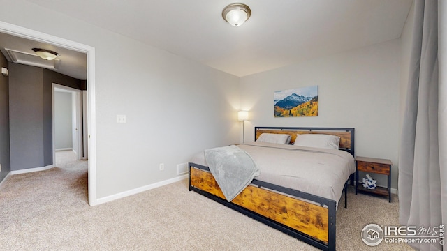 carpeted bedroom featuring baseboards