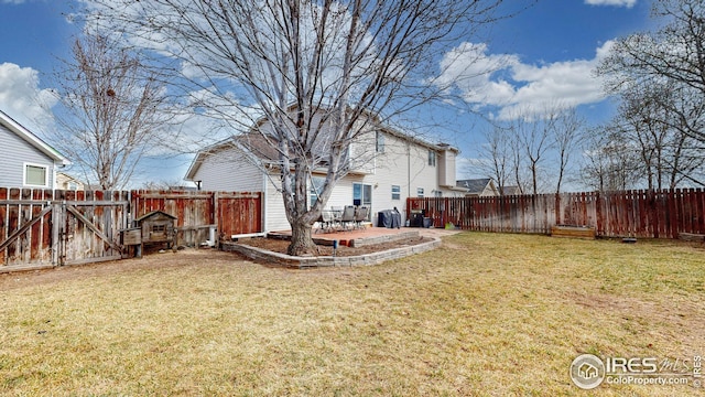 view of yard featuring a patio area, a gate, and a fenced backyard