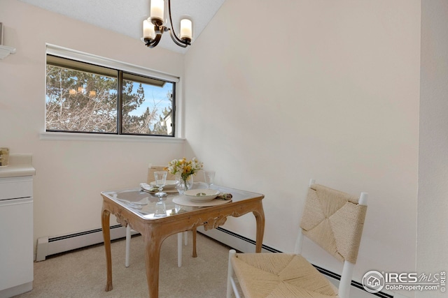 dining room featuring a baseboard heating unit, carpet floors, lofted ceiling, and a chandelier