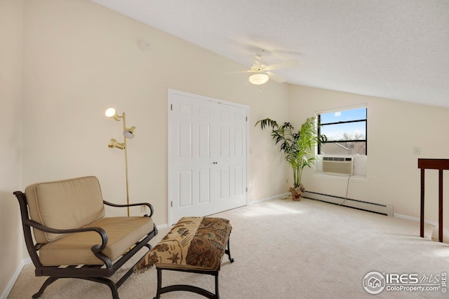 sitting room with baseboards, carpet, vaulted ceiling, baseboard heating, and cooling unit