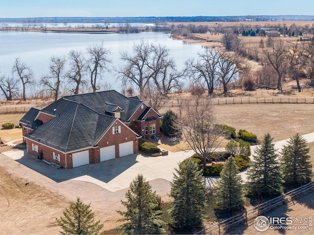 drone / aerial view with a water view