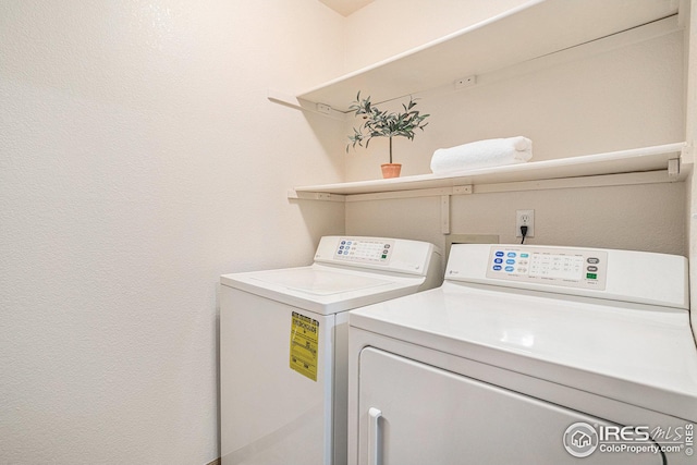 clothes washing area featuring laundry area and independent washer and dryer