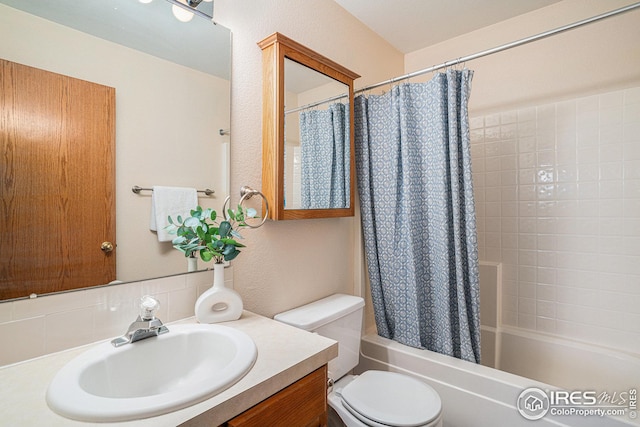 bathroom with vanity, toilet, and shower / bathtub combination with curtain