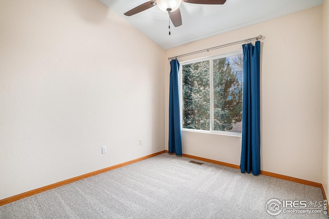 empty room featuring visible vents, ceiling fan, baseboards, and carpet