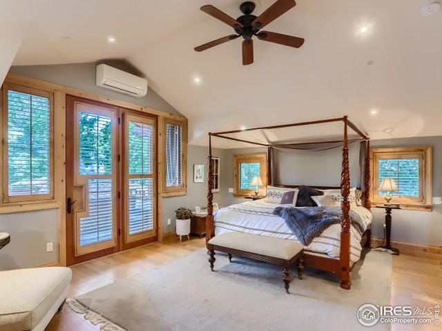 bedroom featuring a wall mounted air conditioner, lofted ceiling, a ceiling fan, and access to outside