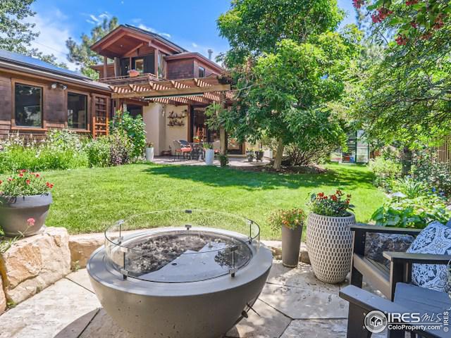 exterior space featuring a yard, a patio area, and a pergola