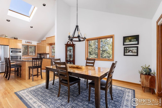 carpeted living area featuring beamed ceiling, high vaulted ceiling, a fireplace, baseboards, and ceiling fan