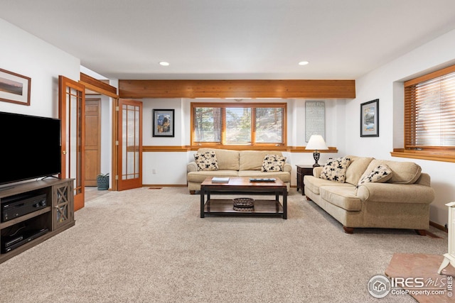 carpeted living room with recessed lighting and baseboards
