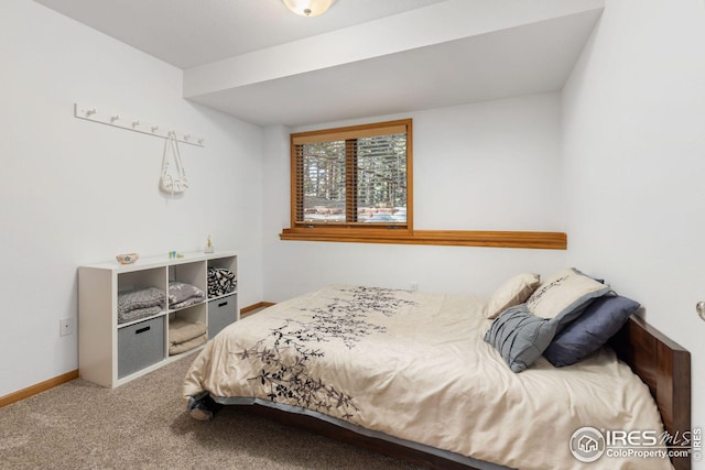 bedroom featuring carpet flooring and baseboards