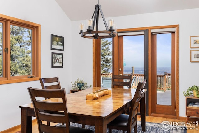 wooden deck featuring grilling area and outdoor dining space