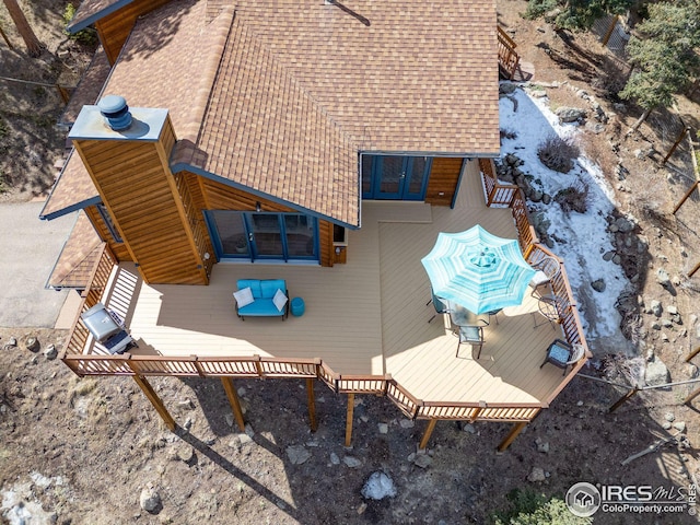 exterior space featuring a wooded view