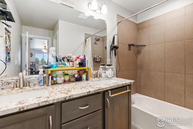 bathroom featuring shower / bath combination with curtain, double vanity, visible vents, and a sink