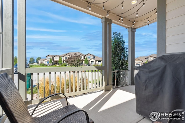 balcony featuring a residential view and a grill