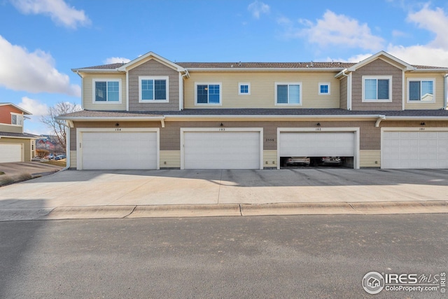 2556 Des Moines Dr Unit 103, Fort Collins, CO 80525 - multi unit property with concrete driveway and an attached garage
