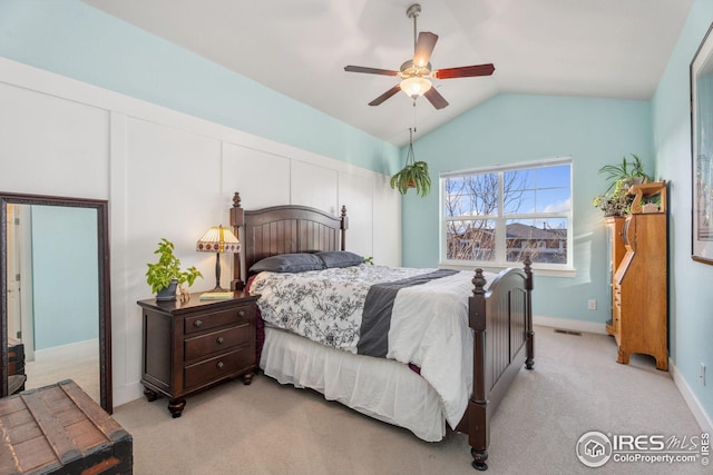 2556 Des Moines Dr Unit 103, Fort Collins, CO 80525 - bedroom featuring visible vents, baseboards, lofted ceiling, light colored carpet, and ceiling fan