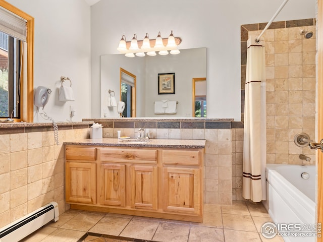321 Overlook Ln, Estes Park, CO 80517 - bathroom featuring a baseboard heating unit, tile walls, shower / tub combo, vanity, and wainscoting