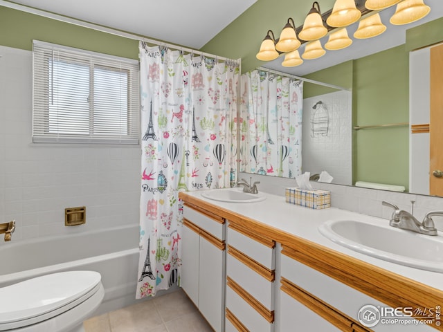 full bathroom featuring tile patterned floors, toilet, shower / bath combo, and a sink