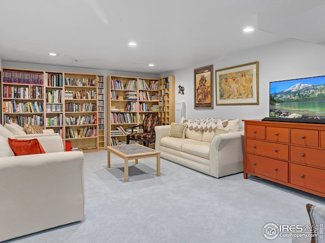 living room with recessed lighting and carpet floors