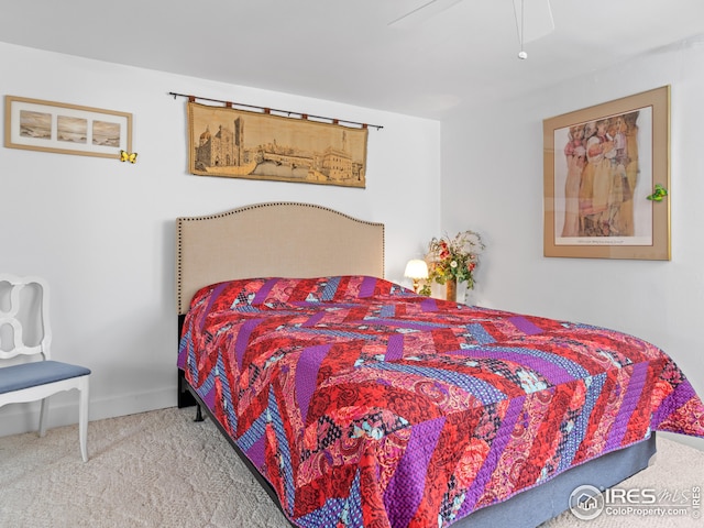 bedroom with carpet flooring, ceiling fan, and baseboards