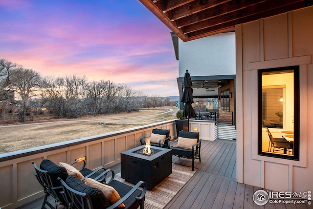 deck featuring an outdoor fire pit