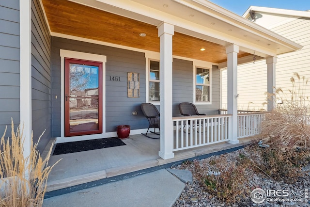 property entrance featuring covered porch