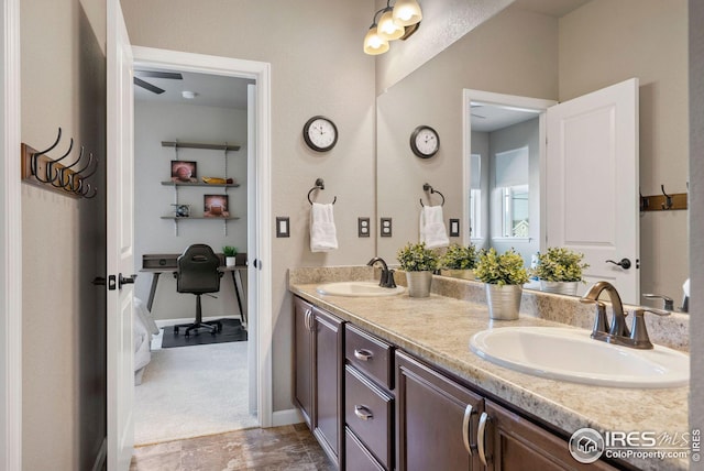 bathroom with double vanity and a sink