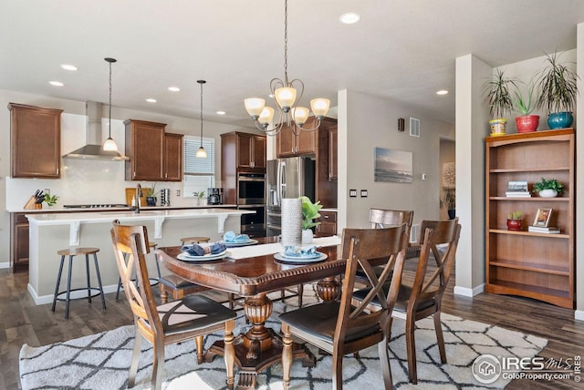 dining area with recessed lighting, an inviting chandelier, dark wood-style flooring, and baseboards