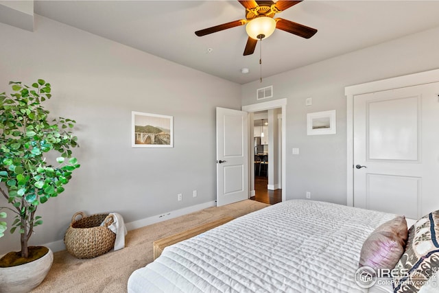 bedroom featuring a ceiling fan, carpet flooring, visible vents, and baseboards