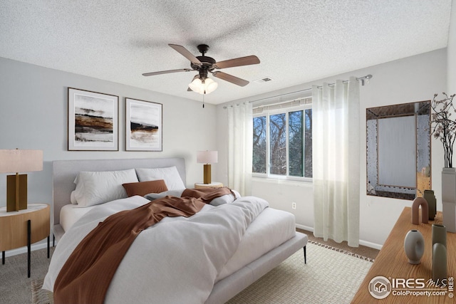 laundry room with water heater, washer and dryer, and laundry area