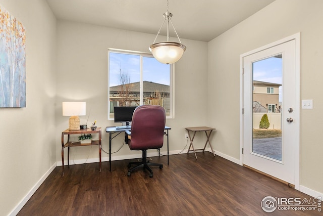 office area featuring plenty of natural light, wood finished floors, and baseboards