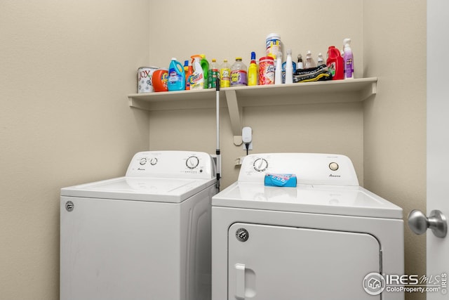 laundry area with laundry area and independent washer and dryer