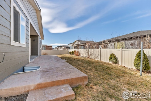 view of yard featuring a fenced backyard and a patio area