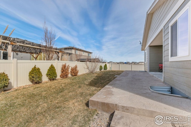 view of yard featuring a patio and a fenced backyard