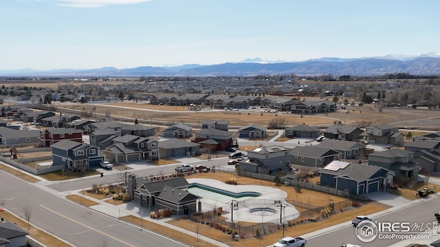 aerial view featuring a mountain view and a residential view