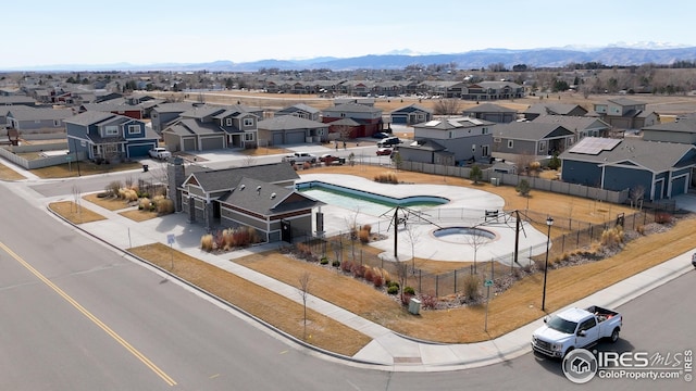 bird's eye view featuring a residential view and a mountain view