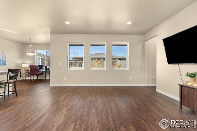 living room featuring dark wood finished floors, recessed lighting, and baseboards