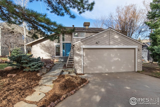 view of front facade with driveway and an attached garage