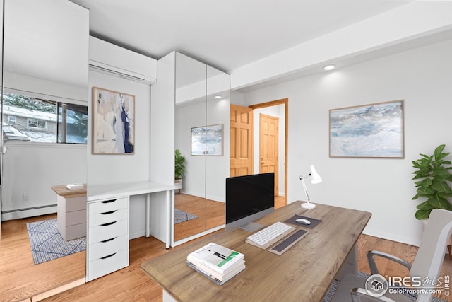 office space with light wood finished floors, recessed lighting, a wall mounted air conditioner, and a baseboard radiator