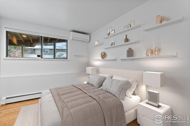 bedroom featuring an AC wall unit, wood finished floors, and a baseboard radiator