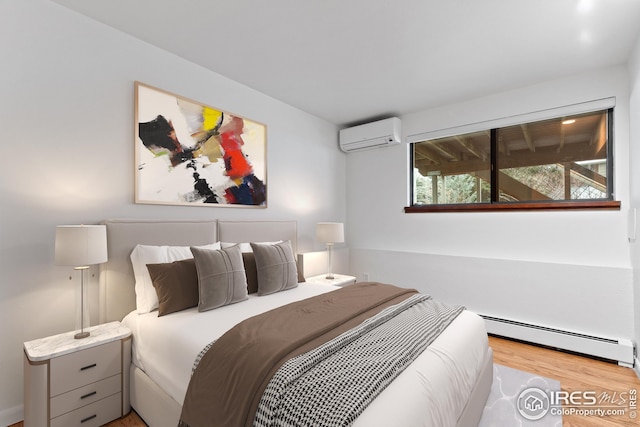 bedroom featuring wood finished floors, a wall unit AC, and a baseboard radiator